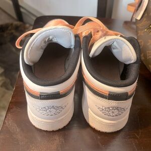 Women’s Peach, White, and Black Jordans size 7y and 9 in women’s